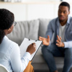 clinician/patient speaking in office